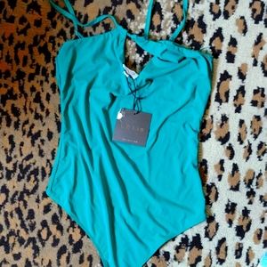 Le Lis collections emerald green smooth strappy bodysuit